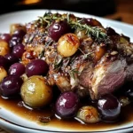 Slow-Roasted Lamb Shoulder with Rosemary, Garlic Cream & Caramelized Grapes